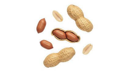 Scattered peanuts, whole, shelled, and halved, with shells and kernels on a white background