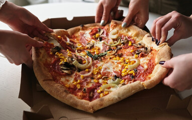 Hands Grabbing Pizza Slices From The Box, Family Enjoying Pizza Dinner