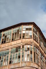 Obraz premium Vintage architecture features wooden windows and balcony