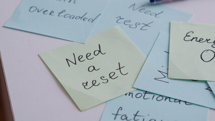 Sticky notes with reminders about emotional burnout and self-care strategies