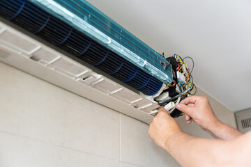 Disassembled Indoor Cooling System in Process of Repair. Air Conditioner Repair and Maintenance.