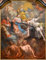 Naklejka premium VERCELLI, ITALY - JANUARY 17, 2026: The painting of God the Father, Virgin Mary and Charles Borromeo with the souls of Purgatory in the church Chiesa di san Salvatore by unknown baroque artist.