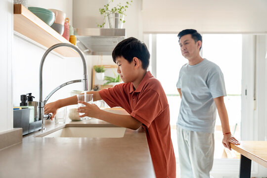 Chinese father and son enjoying quality time at home