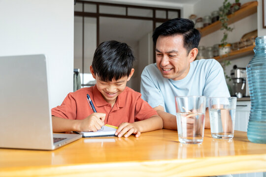 Father and son bonding during study time at home