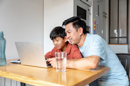 Chinese father and son enjoy digital bonding