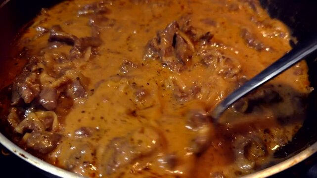 Beef Stroganoff Cooking In Frying Pan. Traditional Gourmet Stew Preparation