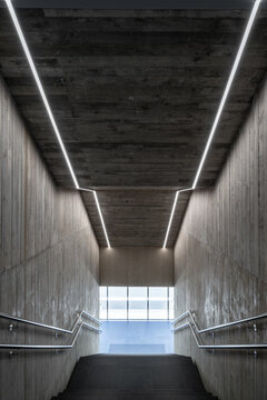 Brutalist sports complex entrance with modern design