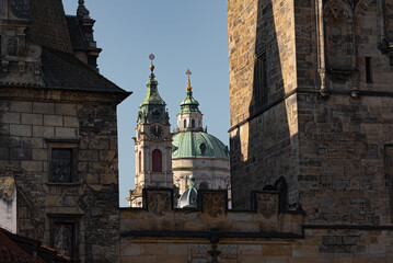 Obraz premium Saint Nicholas Church Dome Framed by Charles Bridge Towers