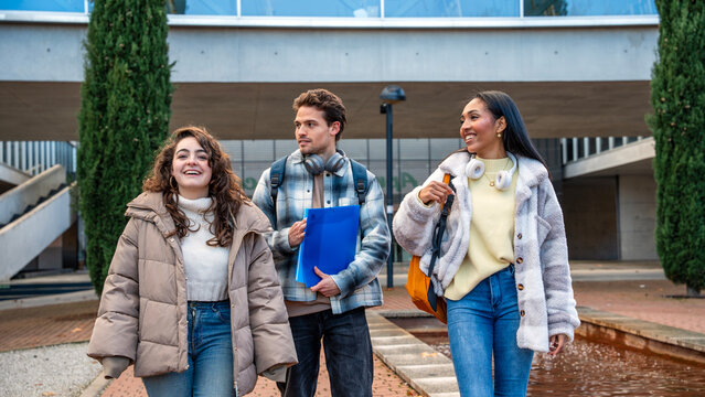 University students walking on campus with smiles