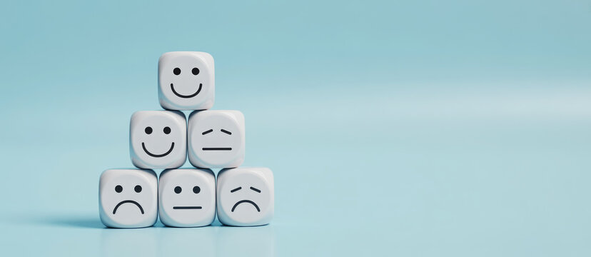 world mental health day concept or feedback rating and positive customer review, wood cube stacking with emotion face icon on blue background 
