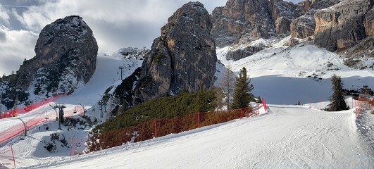 Snow‑covered ski slope in Cortina d’Ampezzo, Dolomites, Italy. Alpine winter scenery highlights sports, travel, and mountain tourism themes for versatile stock photography. © Vasyl  Diachuk