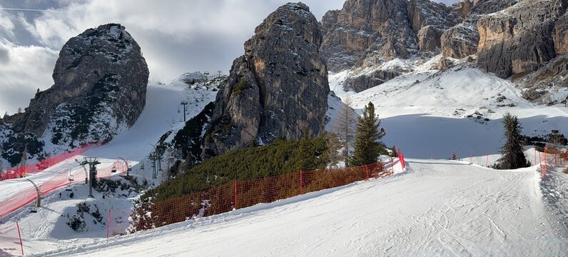 Snow‑covered ski slope in Cortina d&rsquo;Ampezzo, Dolomites, Italy. Alpine winter scenery highlights sports, travel, and mountain tourism themes for versatile stock photography.