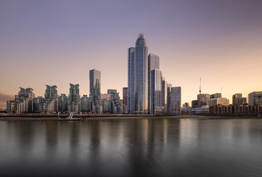 The iconic skyline of Londons Vauxhall and Nine Elms during the golden hour and slack tide.