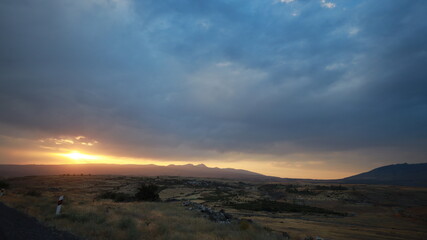 Sunset Over Mountains, Roads and Bridge