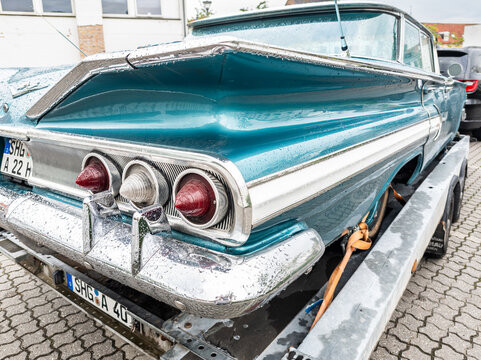 6 july 2025,Maribo, Denmark. Chevrolet impala, turquoise color scheme with white hard top, hardtop sedan. Vintage car,rear view. Typical American classic car with a striking color. Nostalgic car desig