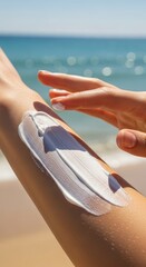 Woman applying sunscreen on beach vacation.