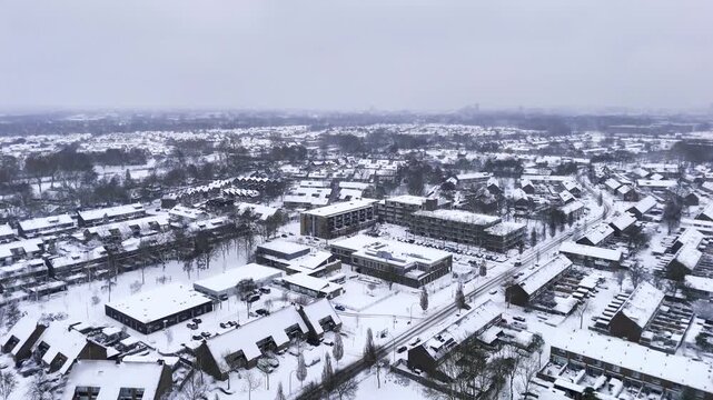 Drone aerial over residential area in winter snow, Zwijndrecht