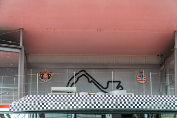 Obraz premium Formula 1 podium structure nearly completed on the Monaco street circuit, with fencing and event infrastructure installed weeks before the Grand Prix.