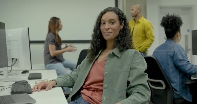 Portrait of  Woman Looking at camera in Contemporary Office