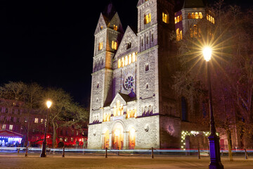The view of Temple Neuf the Protestant city church at night , Metz, France. It was constructed between 1901 and 1904 to serve the growing Protestant community .