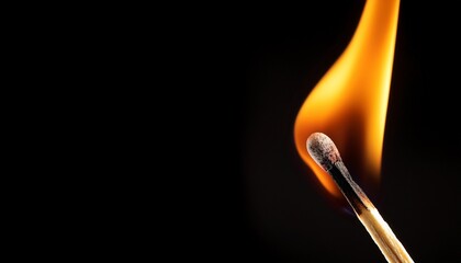 Burning Matchstick Flame On Black Background High Dynamic Range Isolated Shot With Copy Space For Design