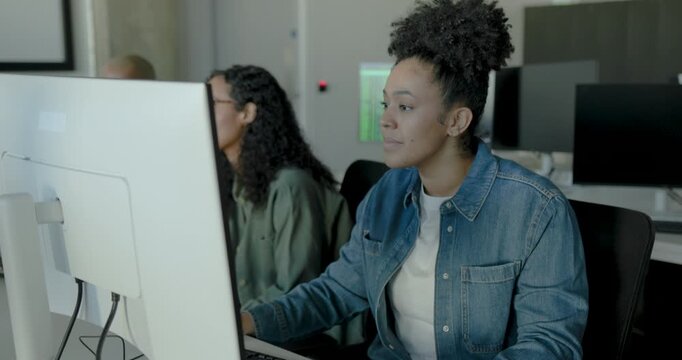 Focused businesswoman working at her desk in a modern workspace office