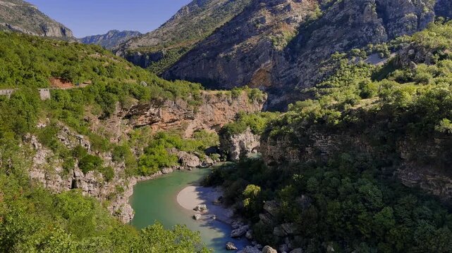 Montenegro, picturesque scenery of a mountain range with a mountain river on a sunny day, a mountain range in the background