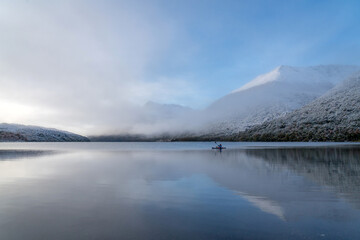 A kayaker on a beautiful morning on a lake in Patagonia Chile