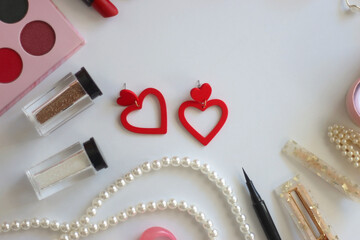 Various accessories and beauty products on white background. Coquette aesthetic. Flat lay.