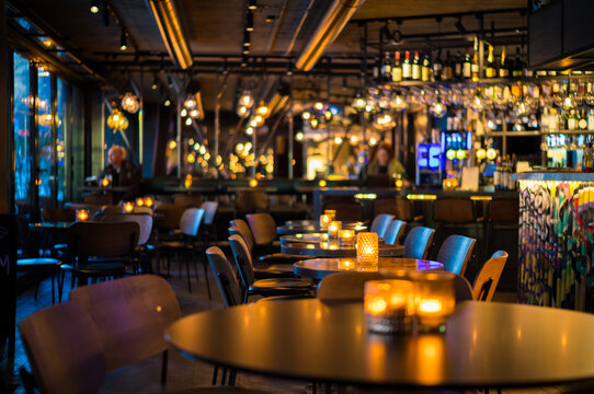 Chic Contemporary Restaurant Interior with Warm Ambient Lighting and Stylish Decor for a Perfect Dining Experience