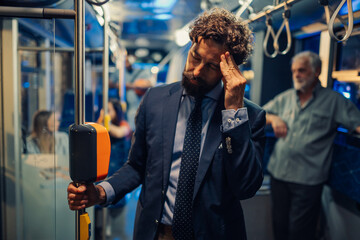 Businessman feeling tired and stressed while commuting by bus © Zamrznuti tonovi