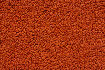 Rust orange fleece fabric texture for cozy blankets and creative sewing © Iryna Miadzvedzeva