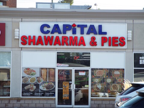 Ottawa, ON, Canada-July 10,2025:The exterior of "Capital Shawarma and Pies" storefront at 1910 St. Laurent Blvd.