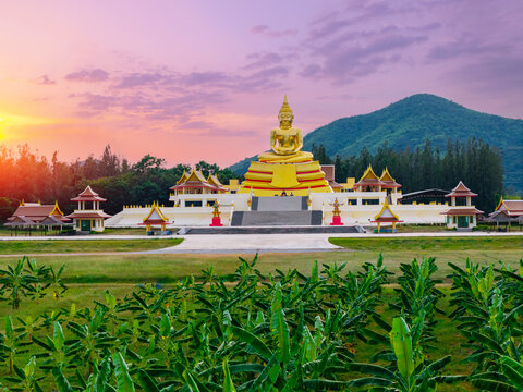 Majestic huay mongkol temple at sunset in hua hin, thailand with serene mountain backdrop