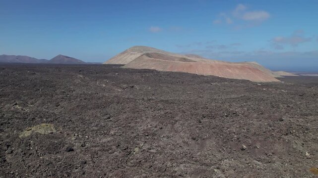 Aerial view of Caldera de Montana Blanca volcanic crater near Timanfaya National Park, Lanzarote, Canary islands, Spain.