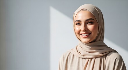 Fototapeta premium Close up Portrait of a Graceful Hijabi Woman with a Serene and Joyful Expression