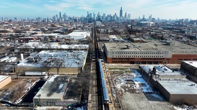 Cinematic 4K Drone Aerial Chicago Skyline Flying to Downtown Over CTA Green Line 'L' Train Tracks in Garfield Park