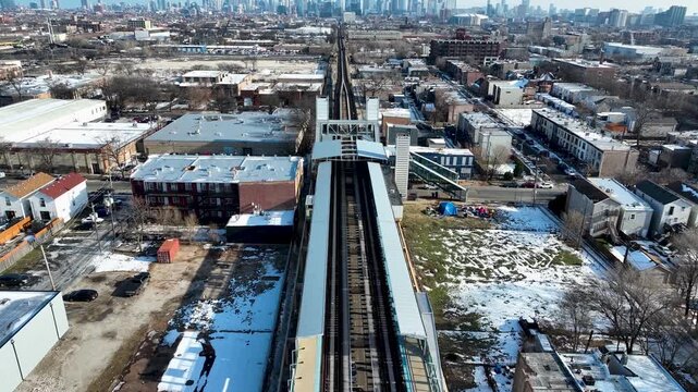 Cinematic 4K Drone Aerial Chicago Skyline Flying to Downtown Over CTA Green Line 'L' Train Tracks in Garfield Park