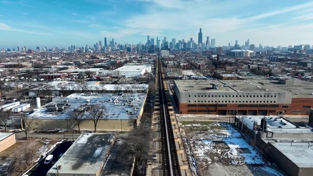 Cinematic 4K Drone Aerial Chicago Skyline Flying to Downtown Over CTA Green Line 'L' Train Tracks in Garfield Park