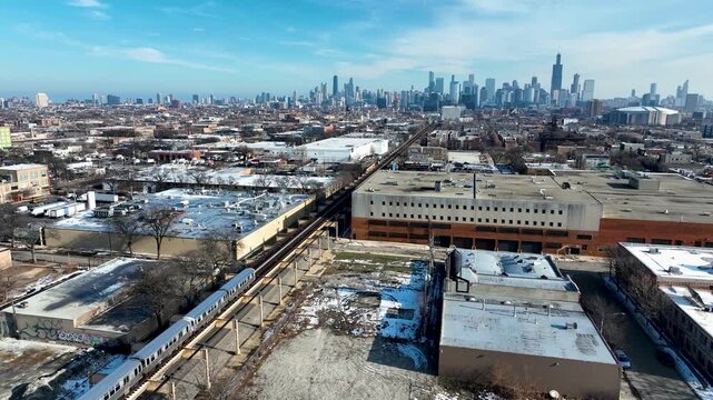 Cinematic 4K Drone Aerial Chicago Skyline Flying to Downtown Over CTA Green Line 'L' Train Tracks in Garfield Park