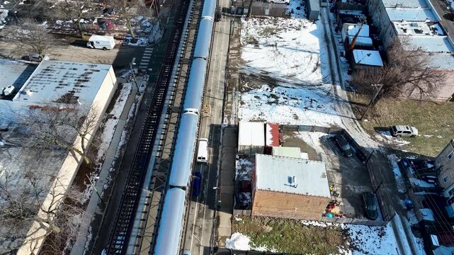 Cinematic 4K Drone Aerial Chicago Skyline Flying to Downtown Over CTA Green Line 'L' Train Tracks in Garfield Park