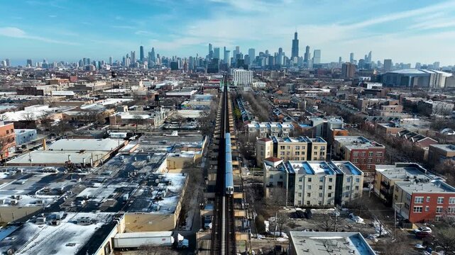 Cinematic 4K Drone Aerial Chicago Skyline Flying to Downtown Over CTA Green Line 'L' Train Tracks in Garfield Park