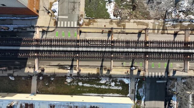 Cinematic 4K Drone Aerial Chicago West Side Flying Over CTA Green Line 'L' Train Tracks in Garfield Park
