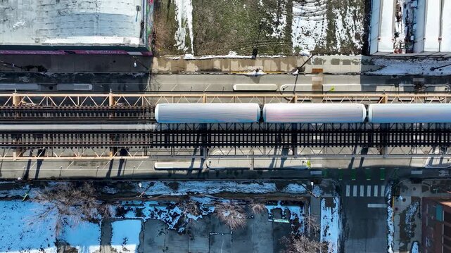 Cinematic 4K Drone Aerial Chicago West Side Flying Over CTA Green Line 'L' Train Tracks in Garfield Park