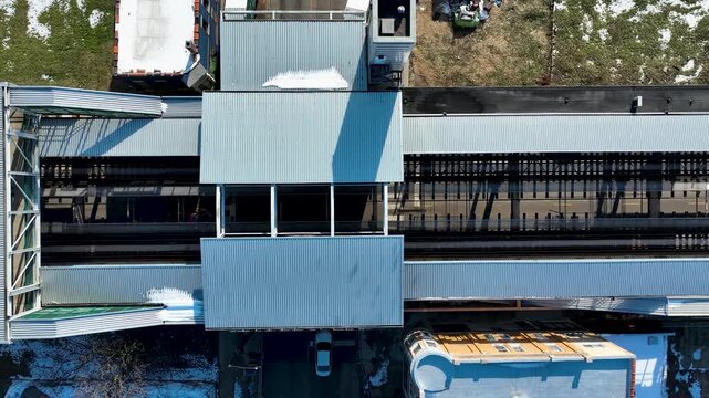 Cinematic 4K Drone Aerial Chicago West Side Flying Over CTA Green Line 'L' Train Tracks in Garfield Park