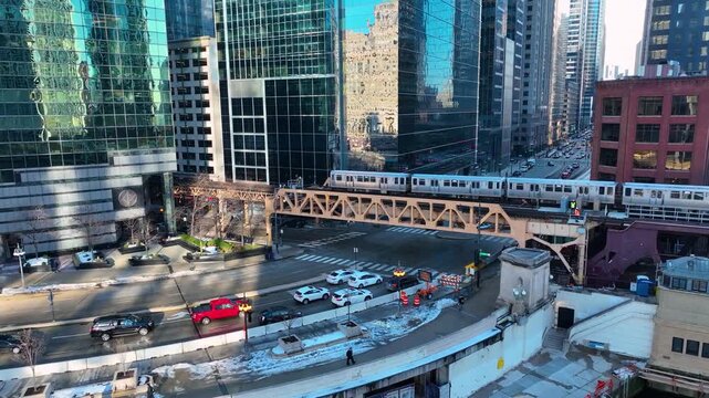 Drone Flying Between Downtown Chicago River Skyscrapers, Sunny Winter Afternoon Aerial of The Loop, Cinematic 4K