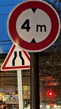 Flashing Road Warning Sign with LED Arrows at Night