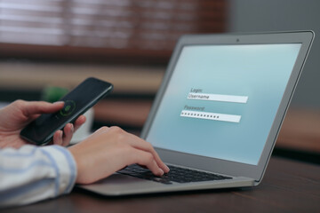 Privacy protection. Woman signing into account with Username and Password on laptop and unlocking mobile phone, closeup