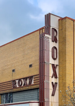 Roxy signs, both horizontal and vertical, on the facade of the Roxy Regional Theatre on Franklin Street in Clarksville, Tennessee. There is copy space in the image.