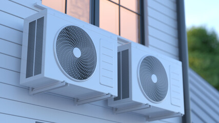 Modern air conditioning units installed on exterior wall of residential house